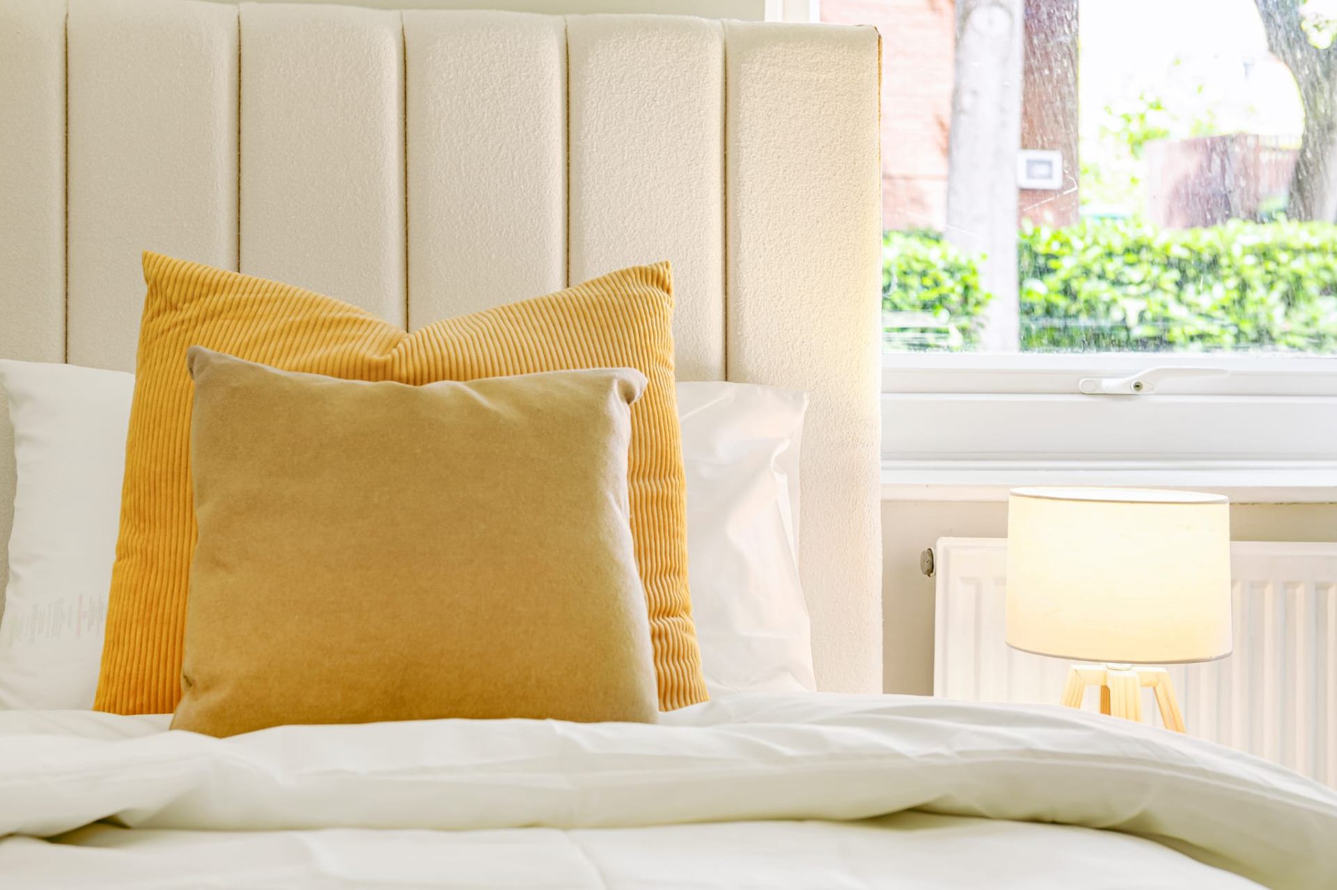 Bedroom — headboard & mustard cushions